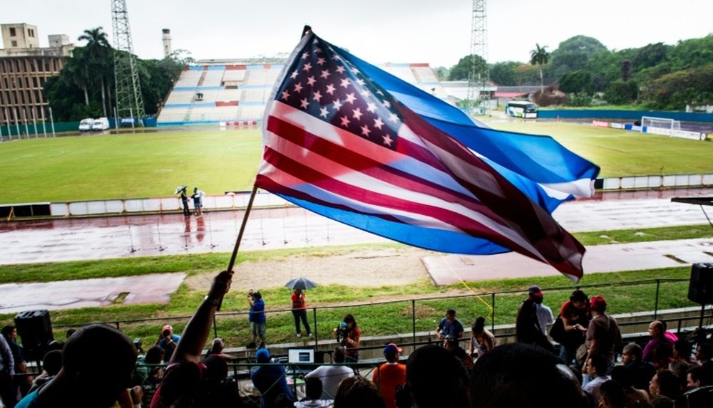 Fans wave Cuban and US flags on June 2, 2015, during the friendly game in Havana between the New York Cosmos and Cuba