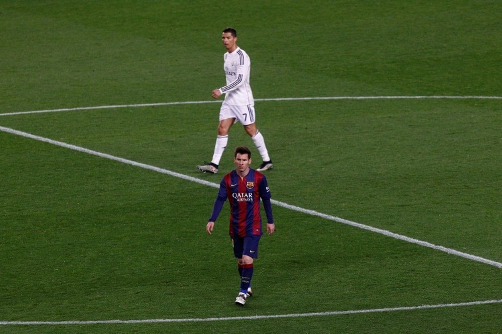 Dani Alves had his say on the ongoing debate: Messi or Ronaldo. AFP