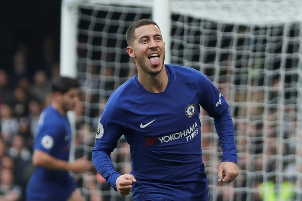 Hazard's father says he is keen on a move to Real. AFP