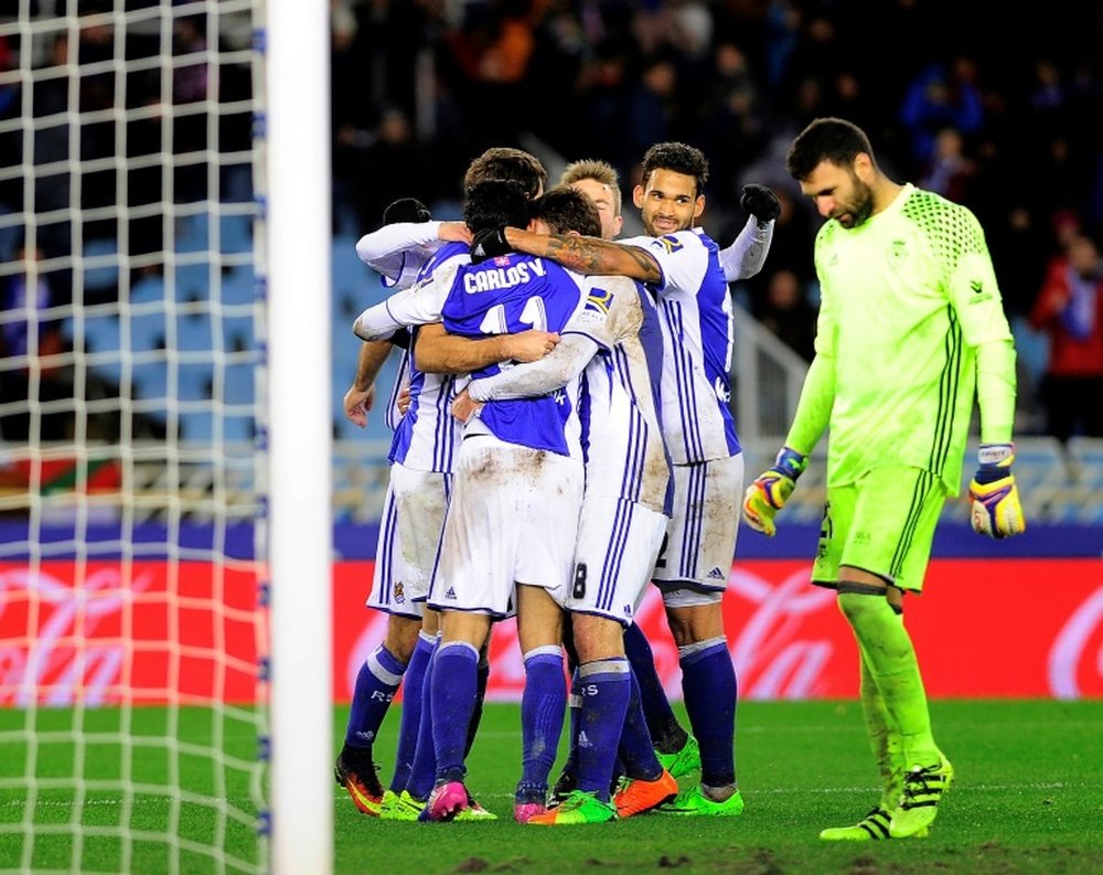 Real Sociedad players celebrate their team's win. Goal