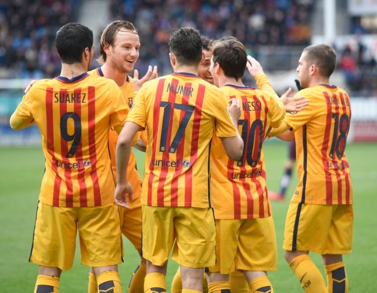 Barcelona players celebrate their second goal on March 6, 2016