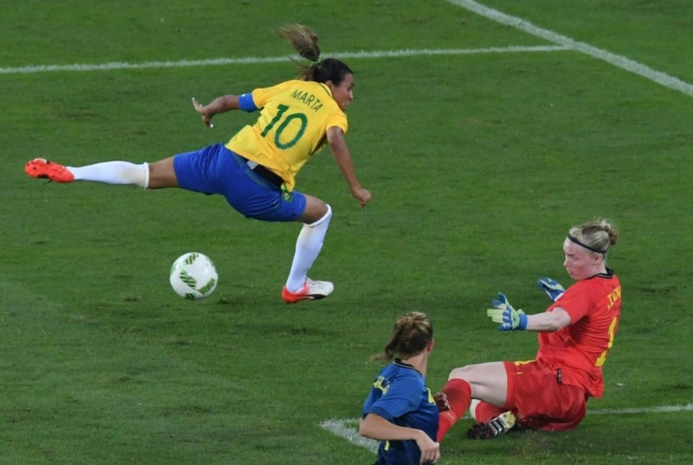 Marta (left) shoots past Swedens goalkeeper Lindahl Hedvig in Rio on August 6, 2016