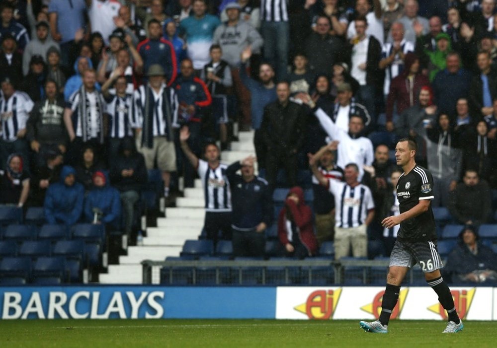 Chelseas English defender John Terry walks from the pitch after receiving a red card during the English Premier League football match between West Bromwich Albion and Chelsea at The Hawthorns in West Bromwich, central England on August 23, 2015