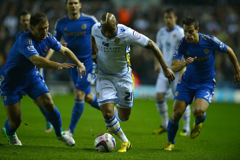 El Hadji Dioufs reputation for footwork and tantrums is well known, but after glory at the World Cup and in Englands Premier League, picture shows him (C) playing for Leeds, the veteran striker now wants political success in his native Senegal