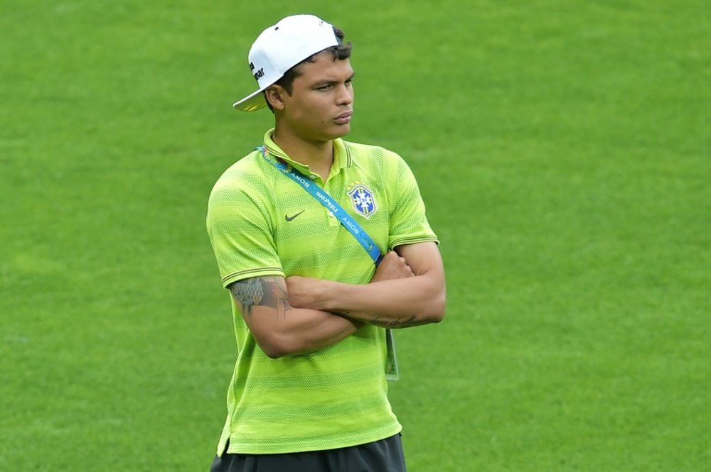 Brazils defender Thiago Silva, absent for the match after picking up a second yellow card, looks on before the semi-final football match between Brazil and Germany in Belo Horizonte during the 2014 FIFA World Cup on July 8, 2014