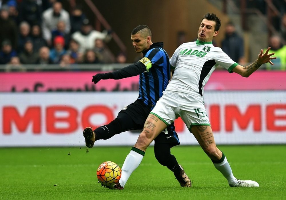 Acerbi vying for the ball with Inter's Mauro Icardi. AFP