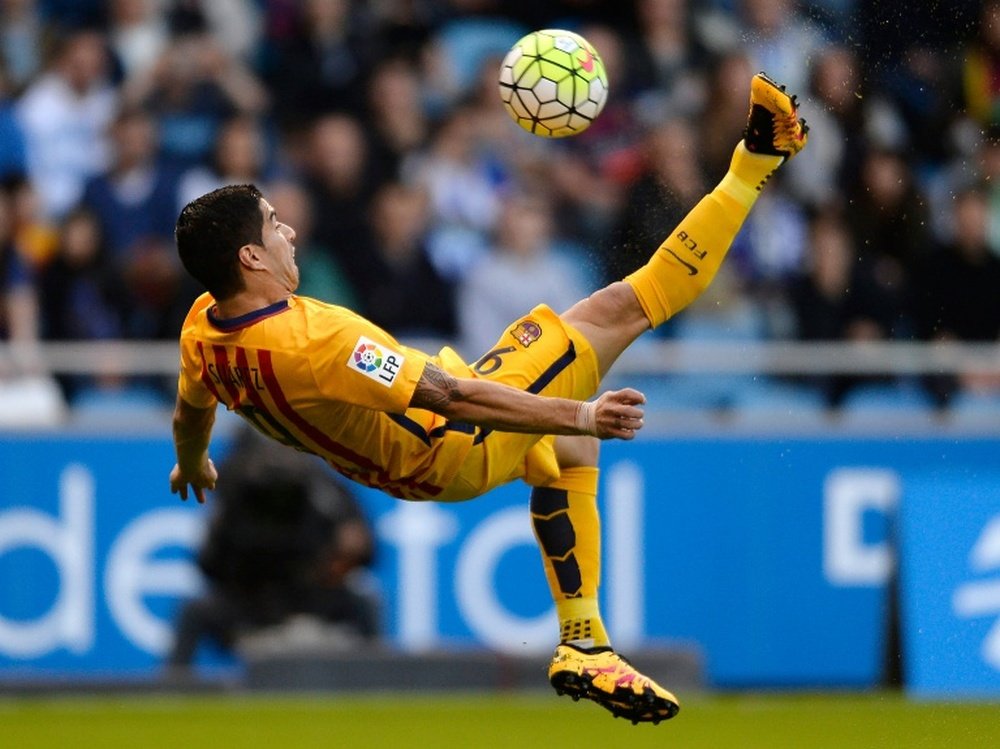 Barcelonas Luis Suarez performs a scissor kick during the match against RC Deportivo de la Coruna in La Coruna on April 20, 2016