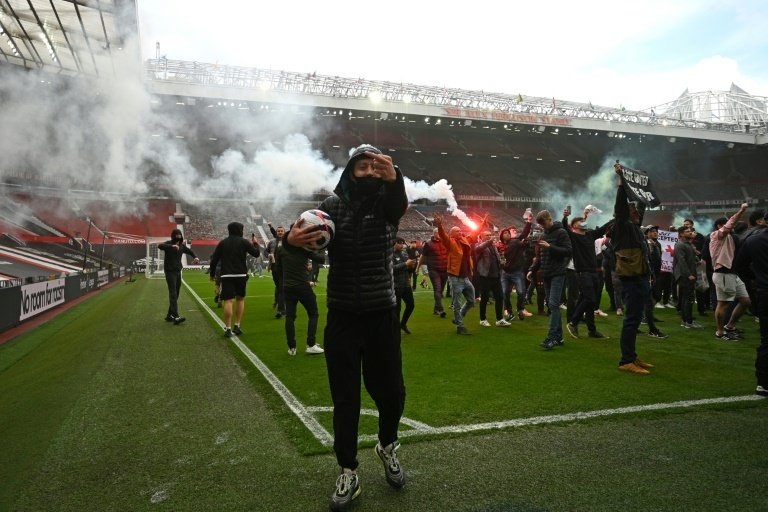 Supporters protest against United's owners inside Old Trafford. AFP