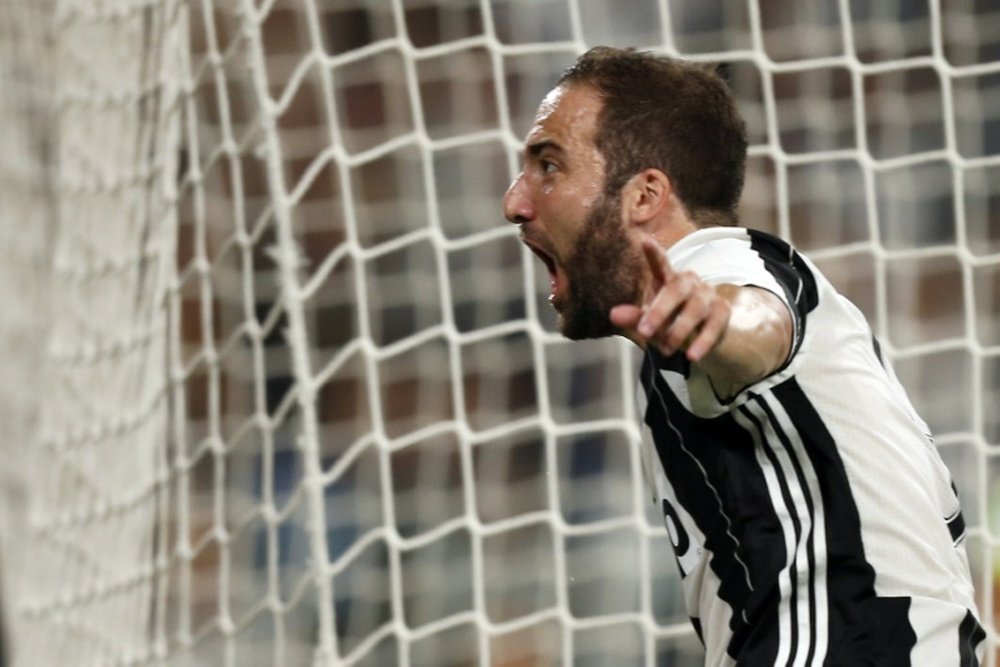 Juventus forward Gonzalo Higuain celebrates after scoring during the Italian Serie A match against Fiorentina