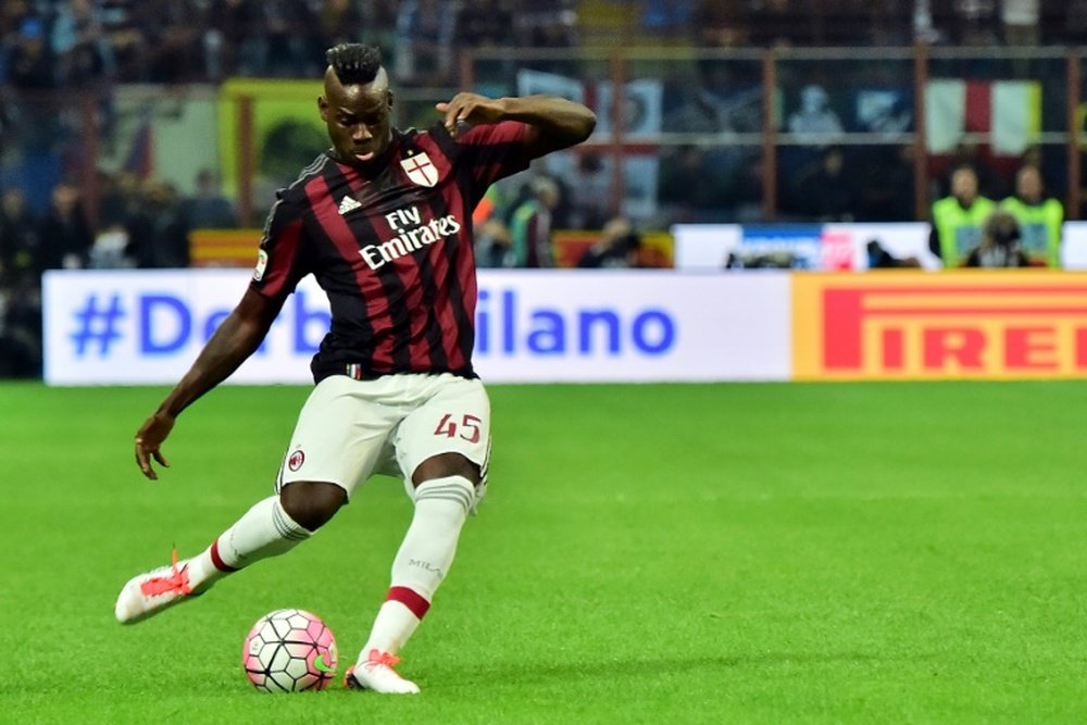 Balotelli takes a shot while at AC Milan. AFP