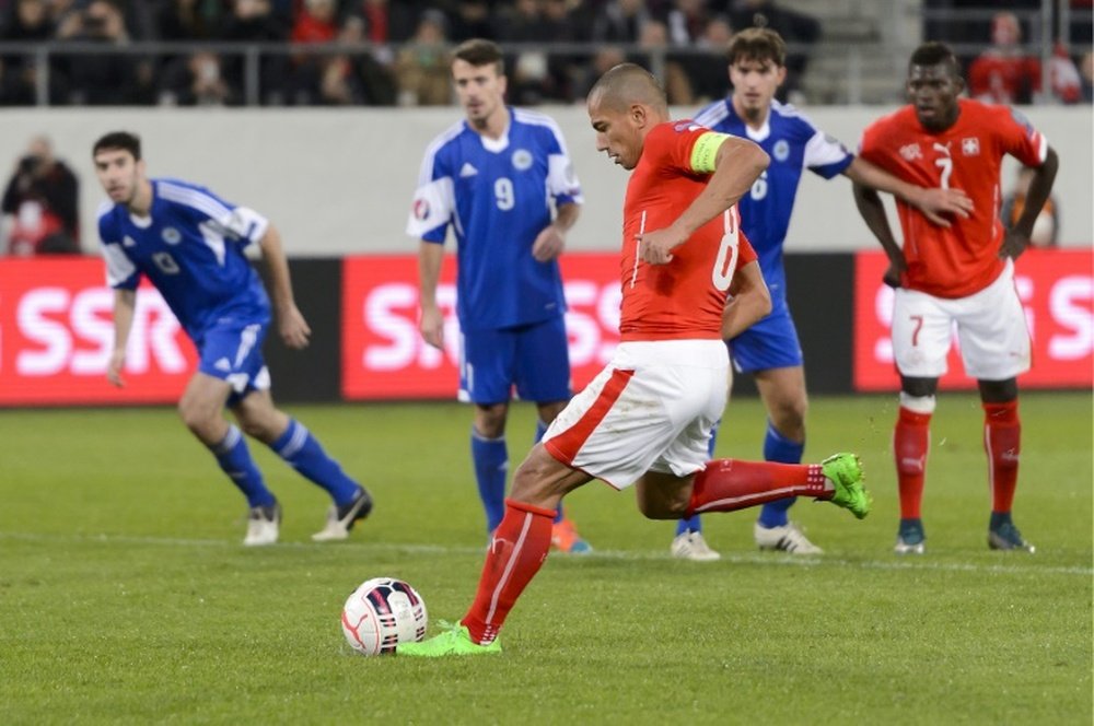 Swiss midfielder Gokhan Inler aims to score a penalty during the Euro 2016 Group E qualifying football match between Switzerland and San Marino on October 9, 2015 at the AFG Arena in St Gallen