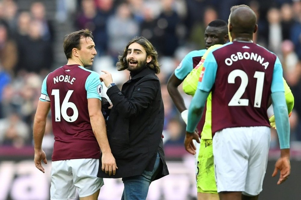 Noble was visibly angered by the pitch invasion. AFP