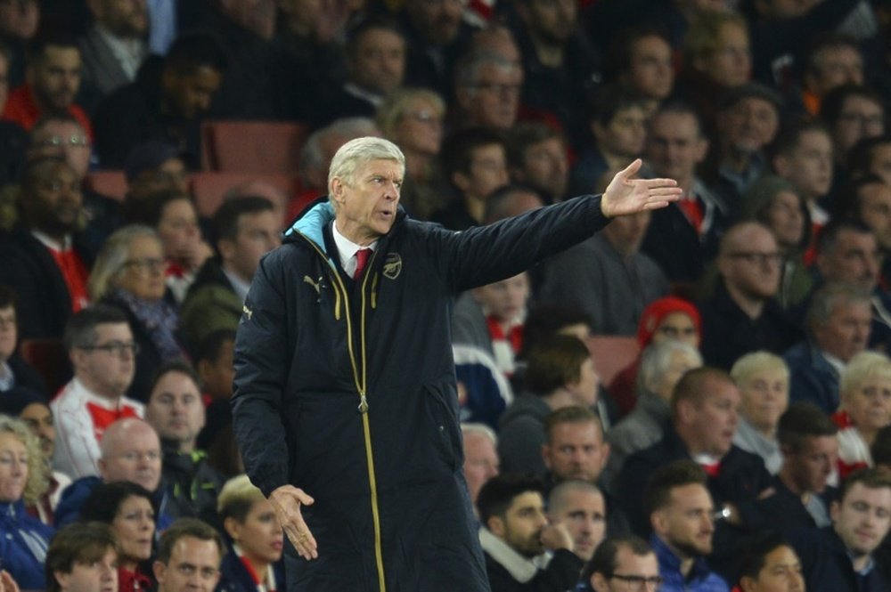 Arsenals French manager Arsene Wenger reacts on the touchline during the UEFA Champions League Group F football match between Arsenal and Olympiakos at The Emirates Stadium in north London on September 29, 2015