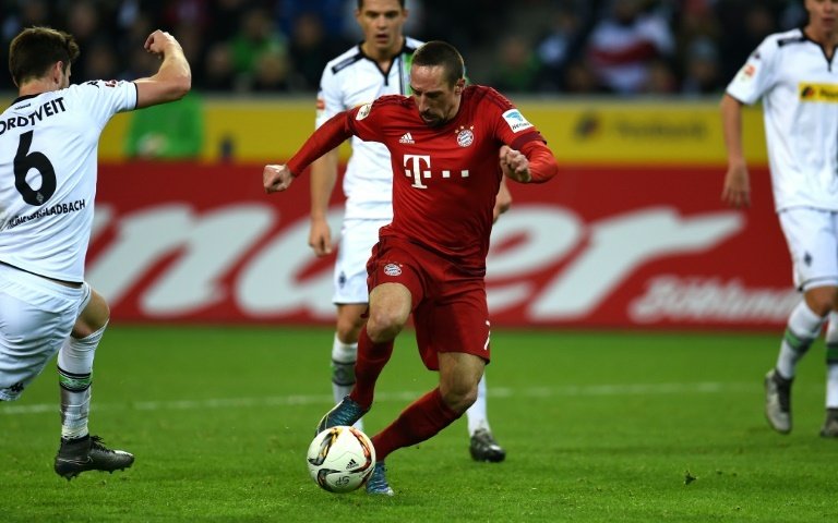 Bayern Munichs midfielder Franck Ribery runs with the ball during a German first division Bundesliga football match against Moenchengladbach on December 5, 2015