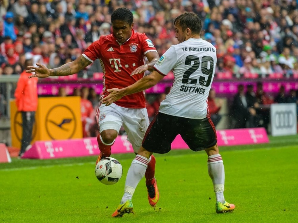 Bayern Munich's Douglas Costa (left) in action against Ingolstadt during a Bundesliga match. AFP
