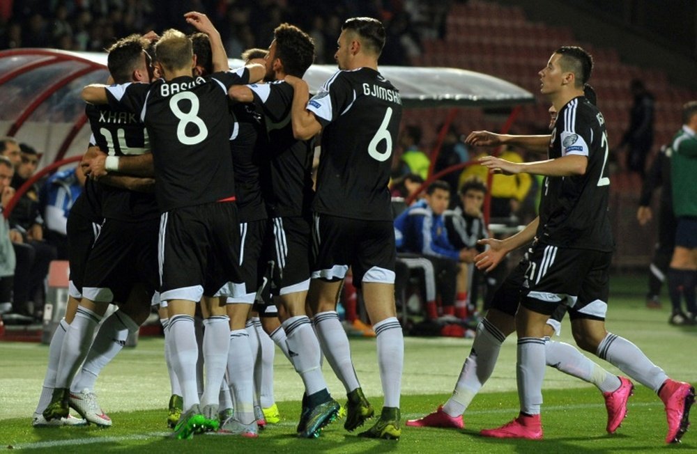 Albanias players celebrate after scoring a goal during a Euro 2016 group I qualifying football match against Armenia on October 11, 2015 at the Replubican stadium in Yerevan