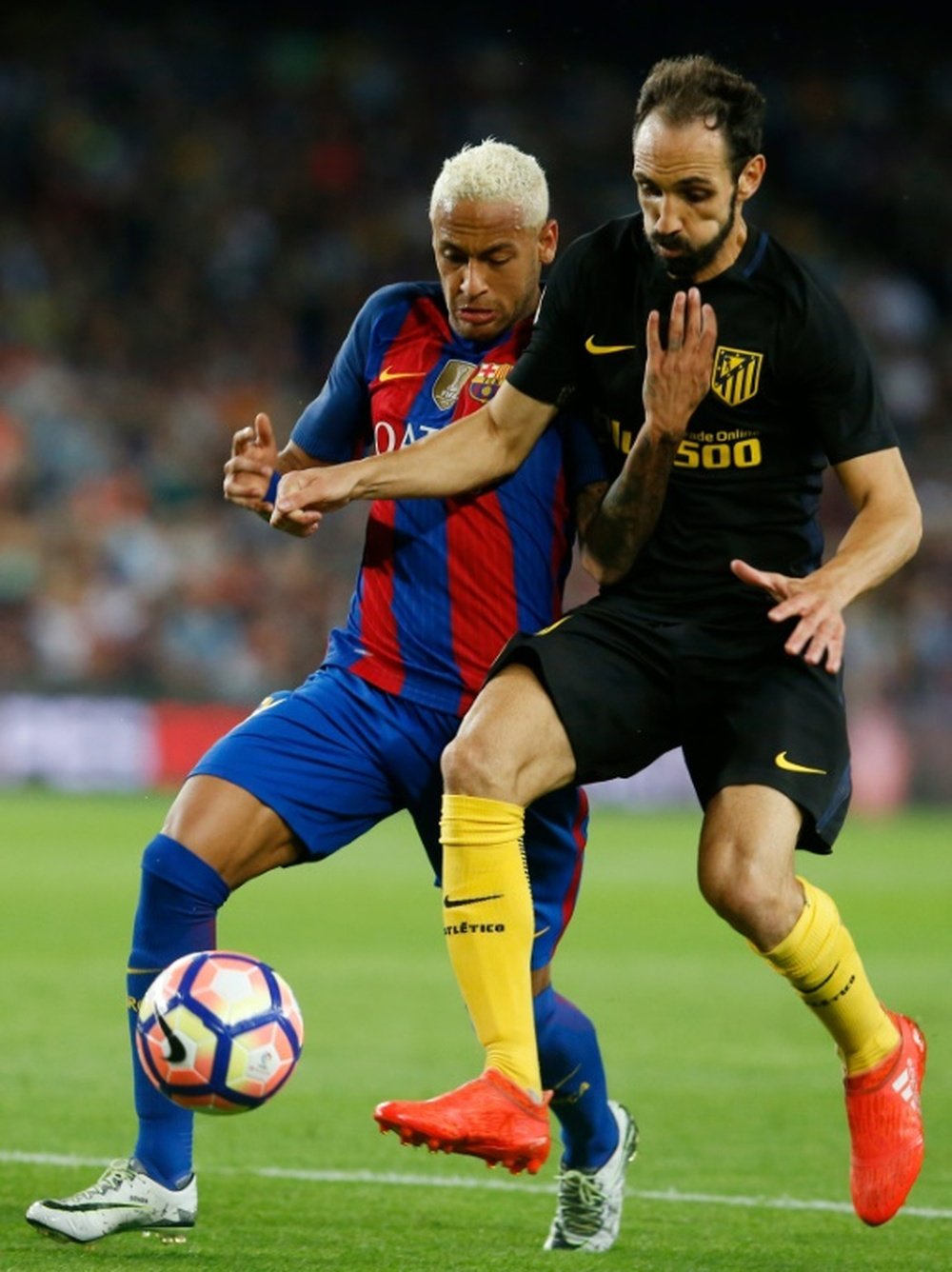 Barcelona's Brazilian forward Neymar vies with Atletico Madrid's defender Juanfran. AFP
