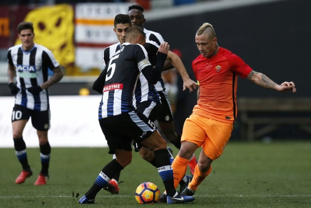 Roma midfielder Radja Nainggolan (R) during the match against Udinese. AFP