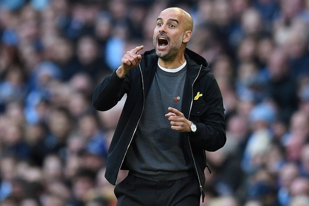 Guardiola's City side are eight points clear at the top of the Premier League after 11 games. AFP