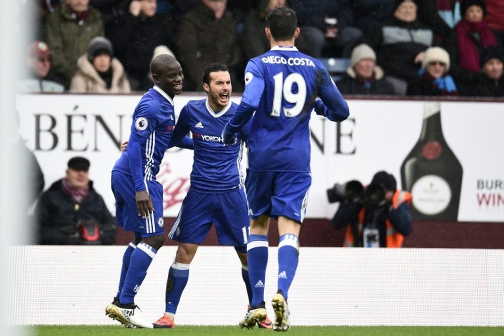 Chelsea's midfielder Pedro (2nd L) celebrates with teammates. AFP