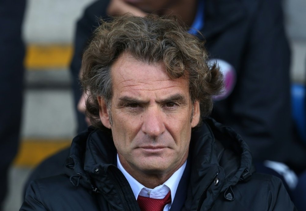 Qatars manager Jose Daniel Carreno looks on during the international friendly football match between Qatar and Northern Ireland at the Alexandra Stadium in Crewe on May 31, 2015