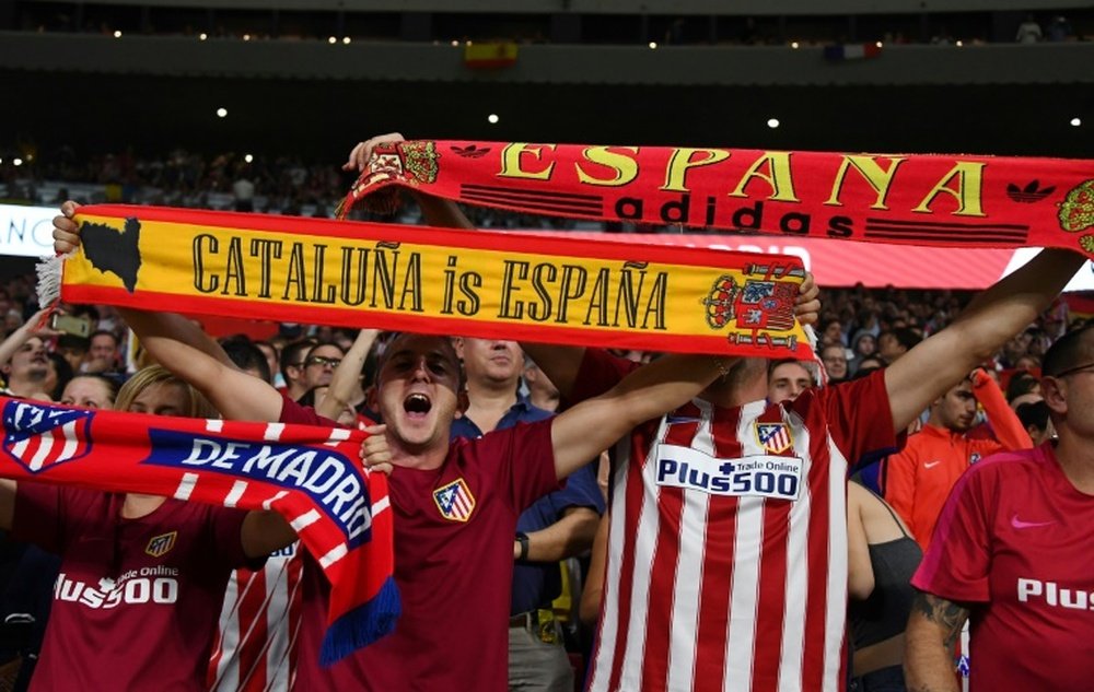 Atletico fans waved Spanish flags ahead of the game. AFP