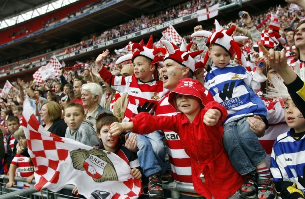 Doncaster Rovers supporters celebrate on May 25, 2008