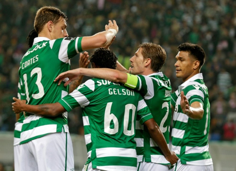 Sportings forward Gelson Martins (2ndL) celebrates a goal with teammates Sebastian Coates (L), Adrien Silva (2ndR) and Teofilo Gutierrez on May 7, 2016