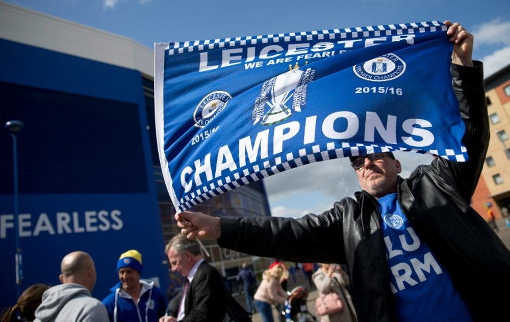 Leicester City fans celebrate winning the Premier League outside the King Power Stadium in Leicester, central England, on May 3, 2016
