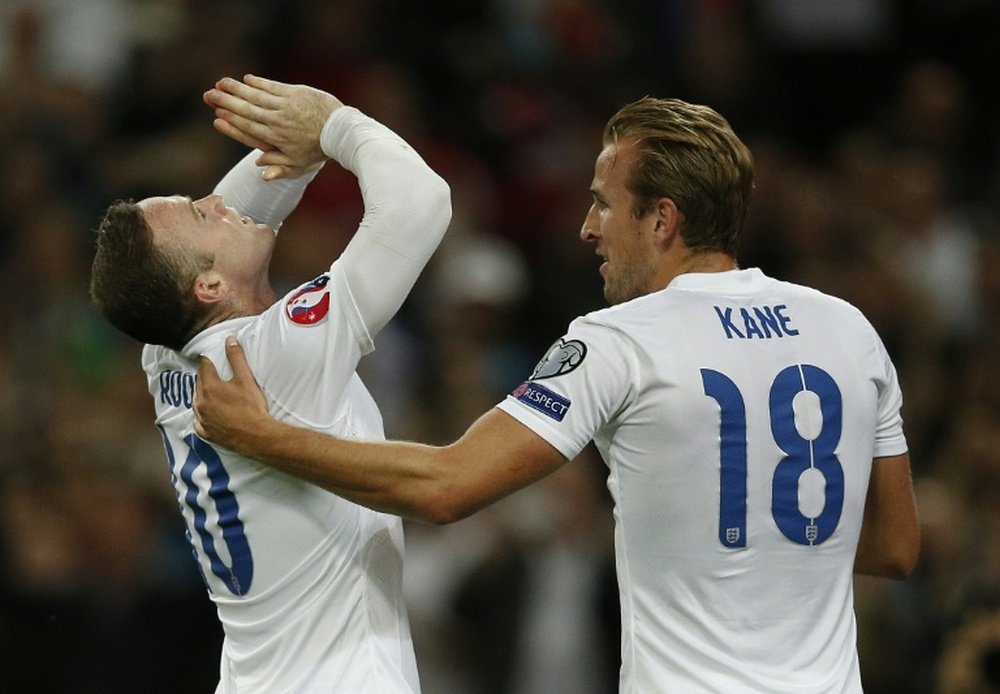 Englands Harry Kane congratulates Wayne Rooney after he scored his 50th international goal during the Euro 2016 qualifying match against Switzerland at Wembley Stadium, on September 8, 2015