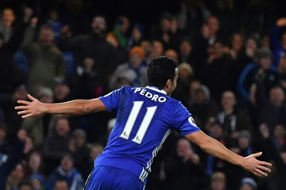 Chelseas midfielder Pedro celebrates scoring the teams third goal during the football match between Chelsea and Bournemouth at Stamford Bridge on December 26, 2016