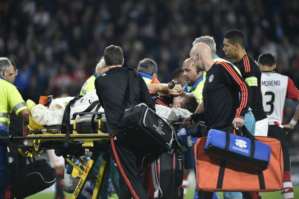 Manchesters Luke Shaw leaves the field after being injured during a UEFA Champions League match against PSV Eindhoven in Eindhoven, Belgium on September 15, 2015