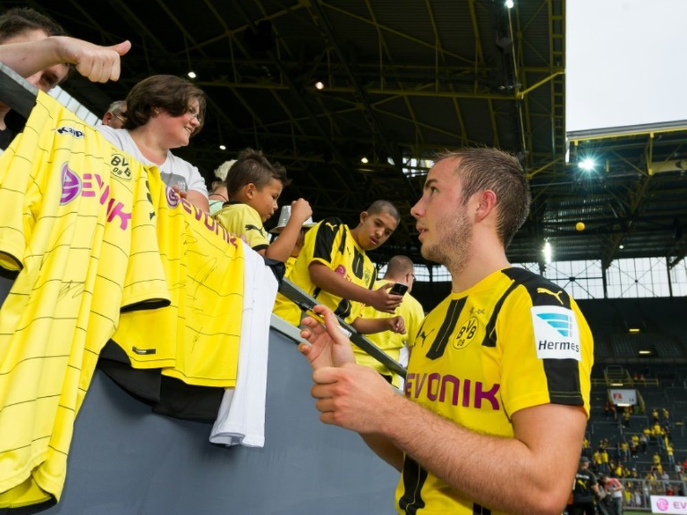 German Bundesliga first division FC Borussia Dortmunds new arrival Mario Goetze signs autographs at Signal-Iduna-Park in Dortmund, on August 13, 2016