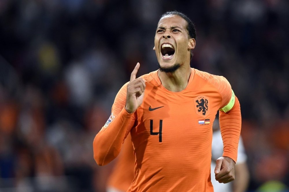 Virgil van Dijk celebrates after scoring the opening goal. AFP