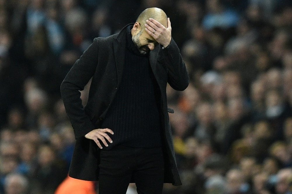 Guardiola cuts a frustrated figure as Man City lose against Leicester. AFP