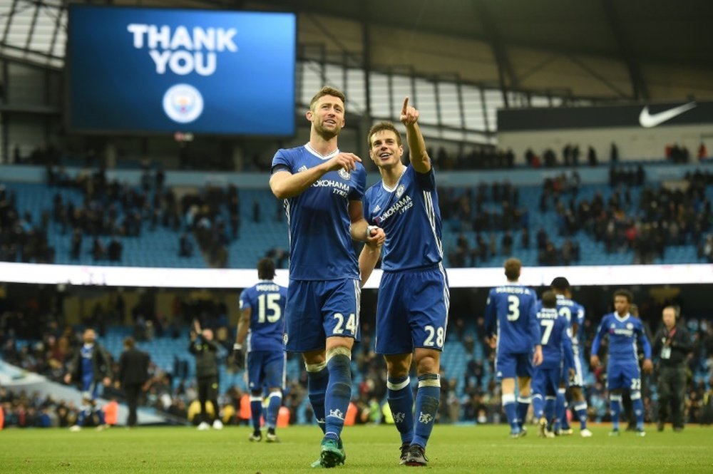 Chelseas Cesar Azpilicueta (R) and Gary Cahill celebrate following their big win, their eighth consecutive victory this season, at Manchester City on December 3, 2016