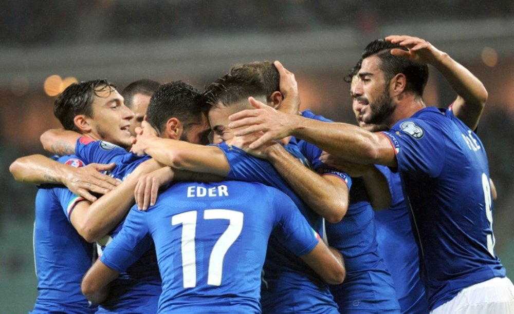 Italys players celebrate after scoring a goal during the Euro 2016 group H qualifying football match between Azerbaijan and Italy on October 10, 2015, in Baku