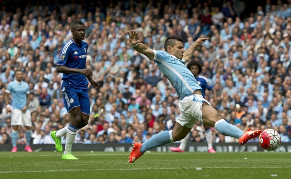 Manchester Citys striker Sergio Aguero stretches to reach the ball during the English Premier League football match against Chelsea in Manchester on August 16, 2015