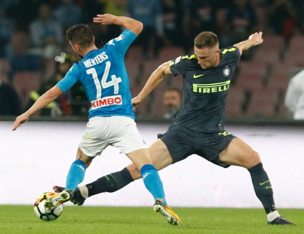 Inter Milans Milan Skriniar (R) fights for the ball with Napolis Dries Mertens. AFP