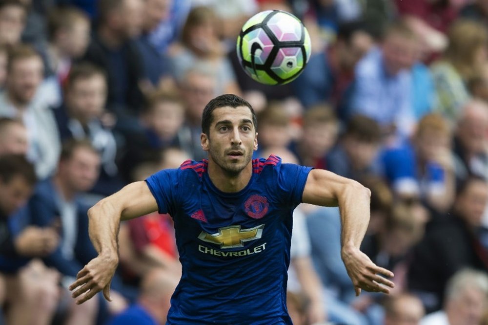 Mkhitaryan takes a throw-in for Manchester United. AFP
