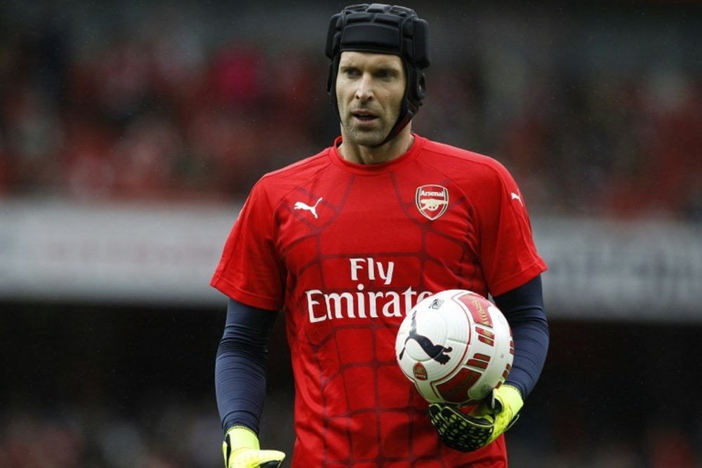 Arsenals Petr Cech warms up ahead of the pre-season friendly against Wolfsburg at the Emirates Stadium in north London, on July 26, 2015
