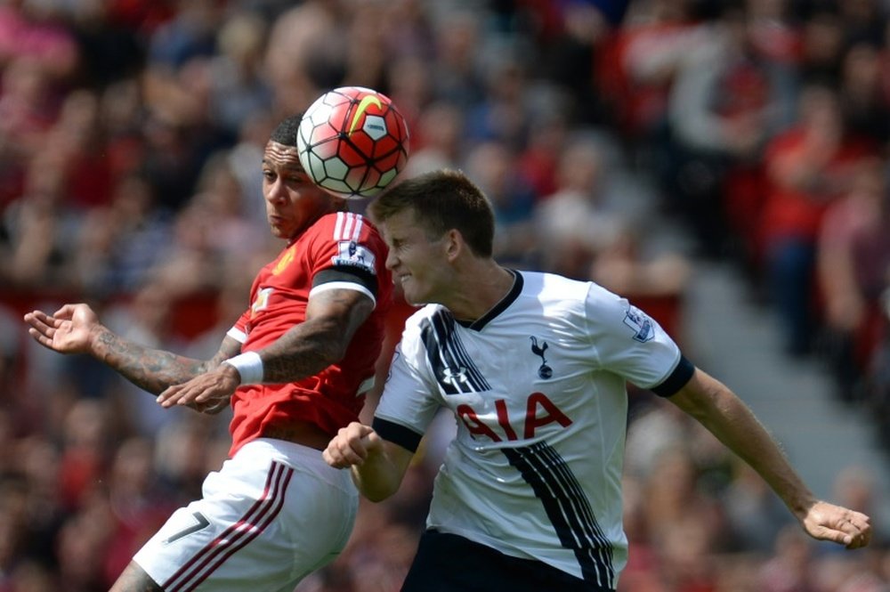 Tottenham Hotspur midfielder Eric Dier (right) in Premier League action against Manchester United on August 8, 2015