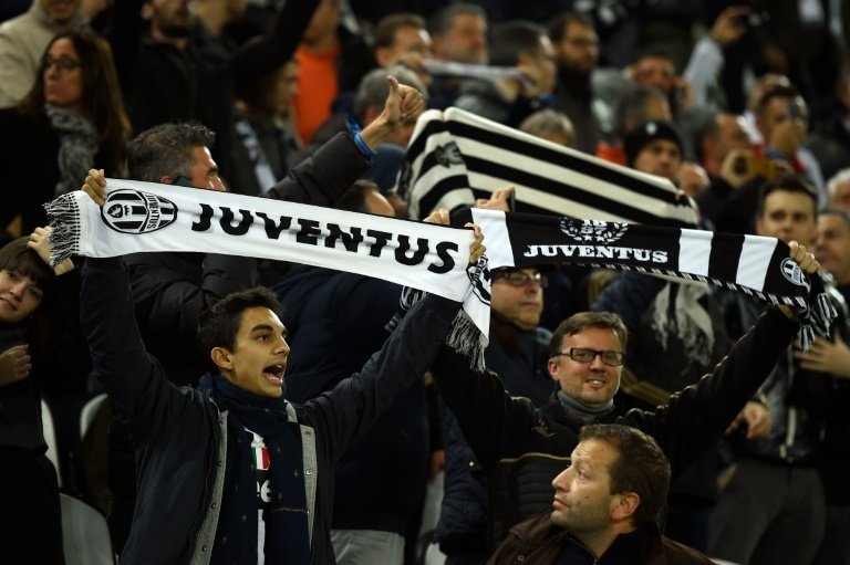 Juventus fans cheer before a match on October 21, 2015 at the Juventus stadium in Turin