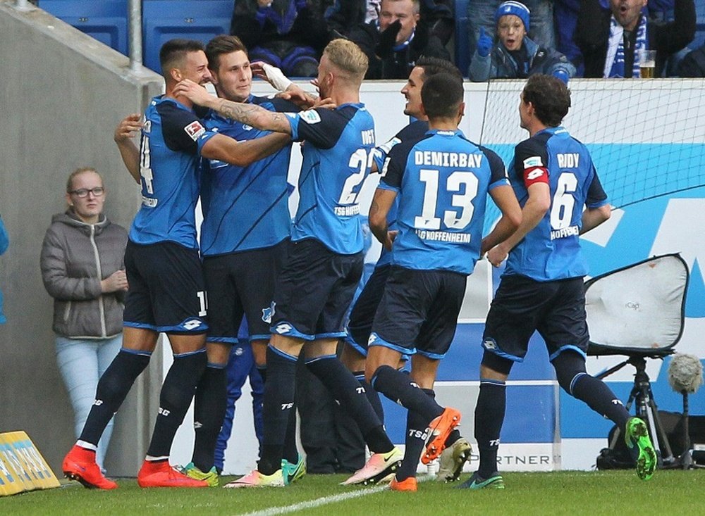 Hoffenheims Suele celebrates with teammates after scoring a goal against Hertha Berlin. AFP