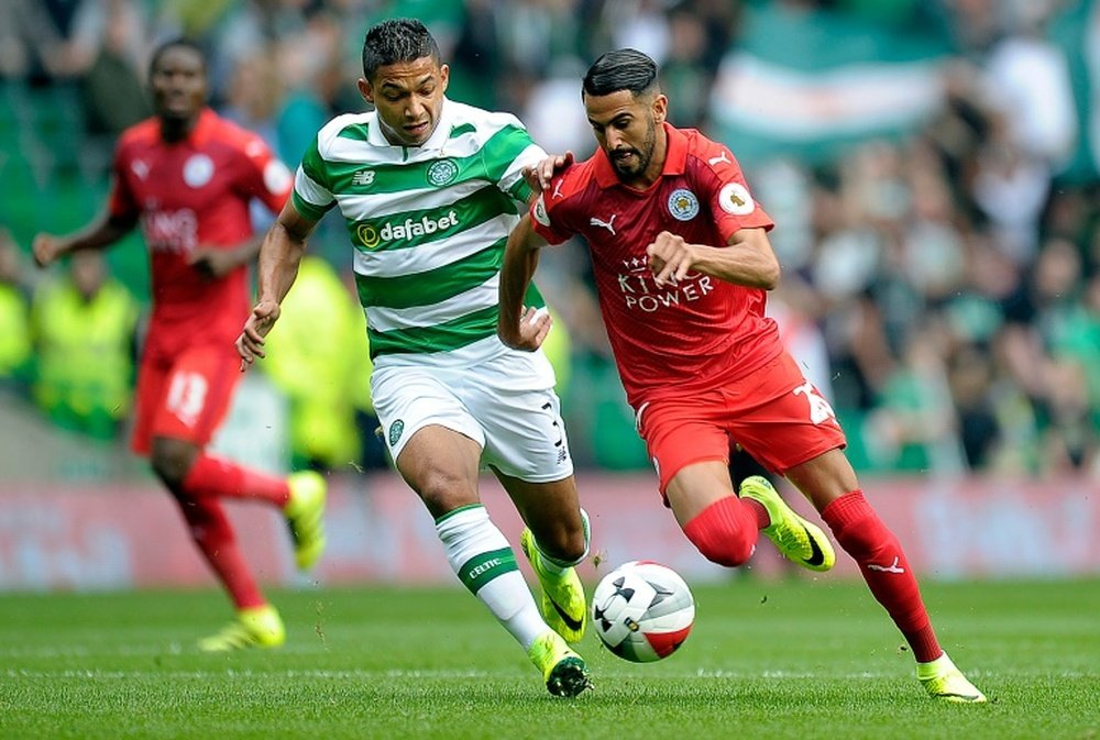 Celtics defender Emilio Izaguirre vies with Leicester Citys midfielder Riyad Mahrez (R) during the International Champions Cup match in Glasgow on July 23, 2016