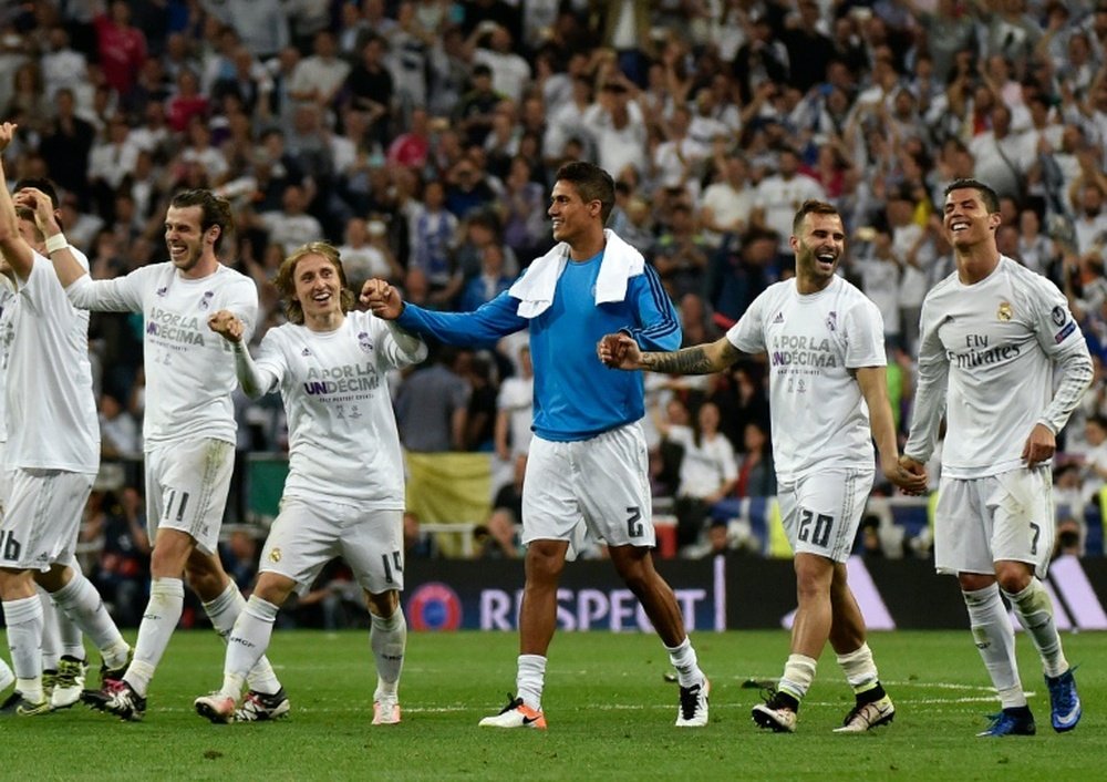 (FromL) Real Madrids Gareth Bale, Luka Modric, Keylor Navas, Jese Rodriguez and Cristiano Ronaldo celebrate their victory at the end of the UEFA Champions League semi-final second leg football match in Madrid, on May 4, 2016