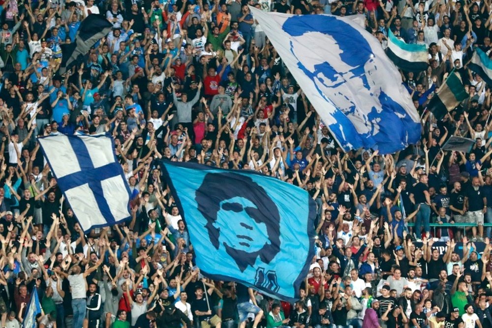 Napolis fans cheer during the UEFA Champions League match against SL Benfica on September 28, 2016 at the San Paolo stadium in Naples