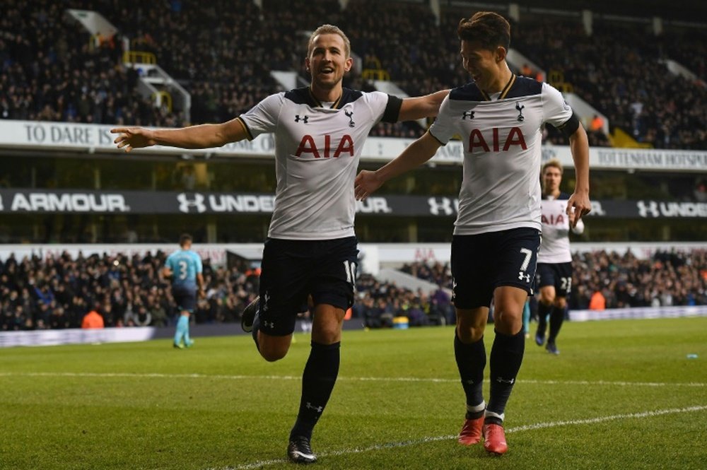 Kane (L) celebrates with Son Heung-Min after scoring from the penalty spot. AFP