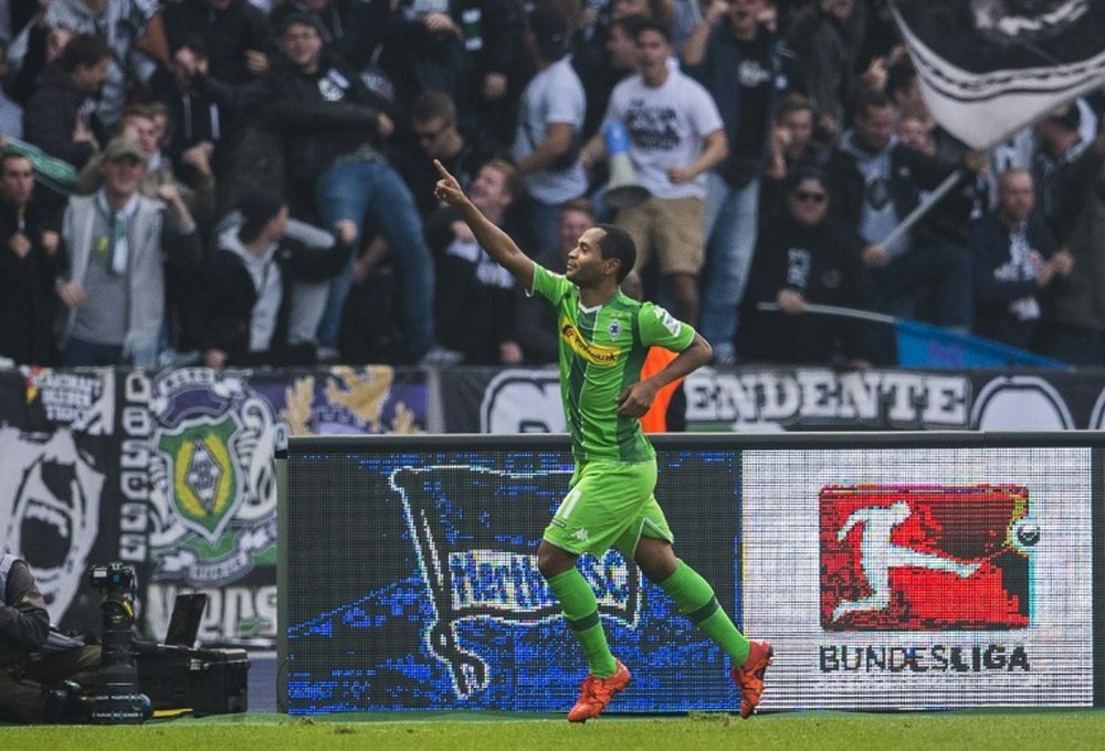 Moenchengladbachs Raffael celebrates scoring his sides second goal during the match against Hertha Berlin at the Olympic stadium in Berlin on October 31, 2015