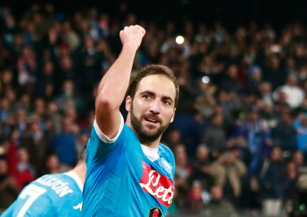 Napolis forward Gonzalo Higuain celebrates after scoring during an Italian Serie A football match against Inter Milan on November 30, 2015 at the San Paolo stadium in Naples